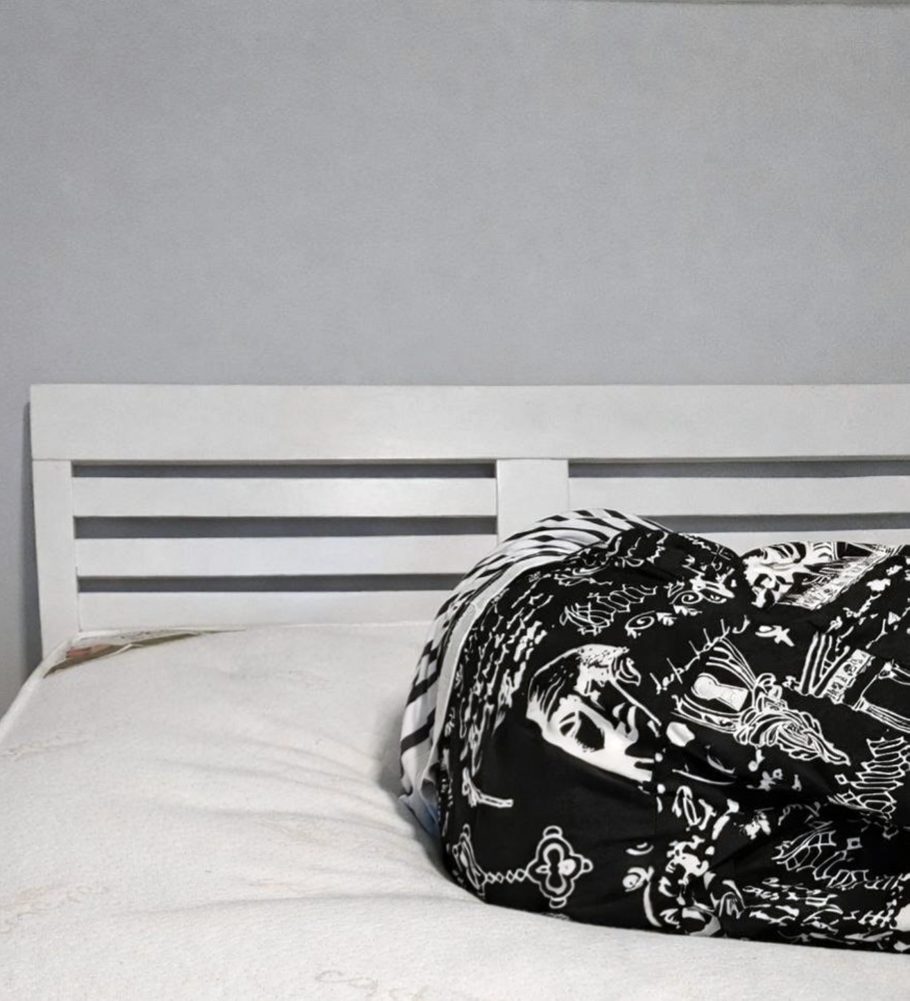 Person lying on old mattress showing dip